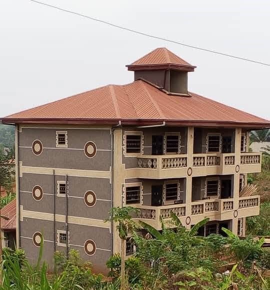 Modern office building front with grey granite cladding in Cameroon